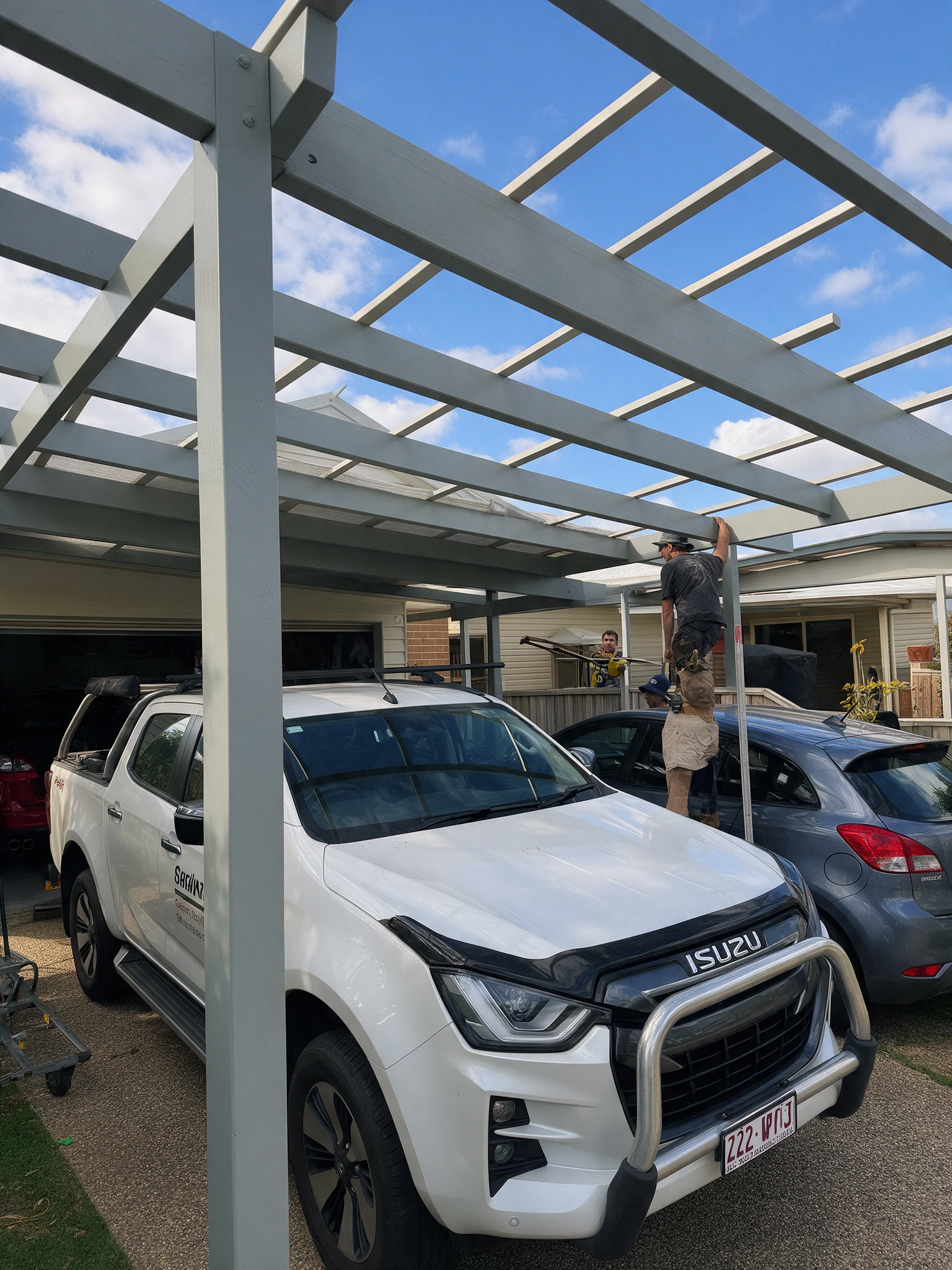 Underside of a pergola and carport roof structure